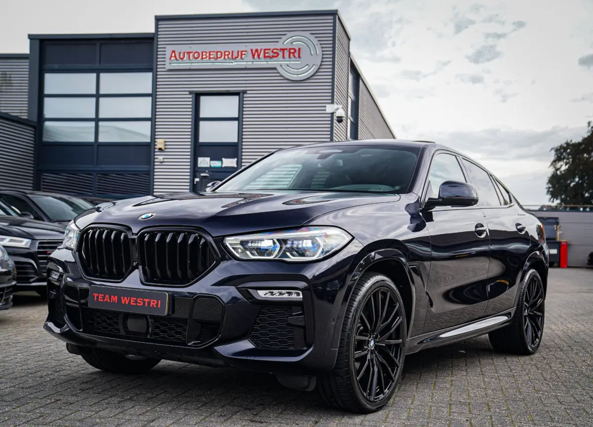 XDrive40i High Executive | Panorama | 360cam | Carbon | Adaptieve cruise control | Kristallen pook | 22 inch | Dealer onder