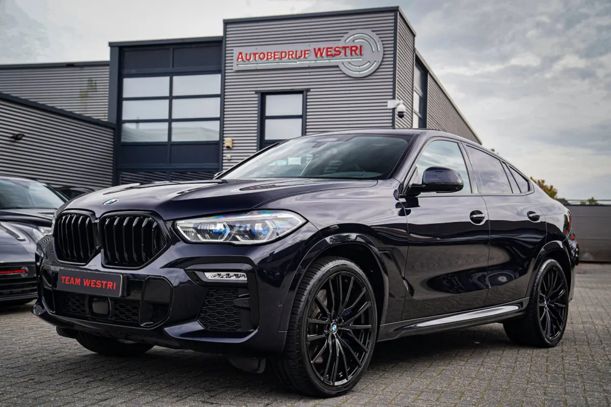 XDrive40i High Executive | Panorama | 360cam | Carbon | Adaptieve cruise control | Kristallen pook | 22 inch | Dealer onder