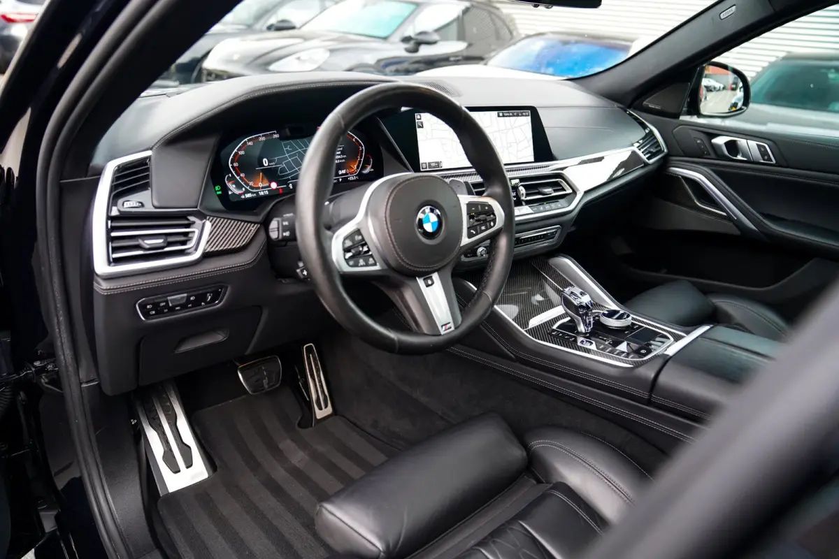 XDrive40i High Executive | Panorama | 360cam | Carbon | Adaptieve cruise control | Kristallen pook | 22 inch | Dealer onder