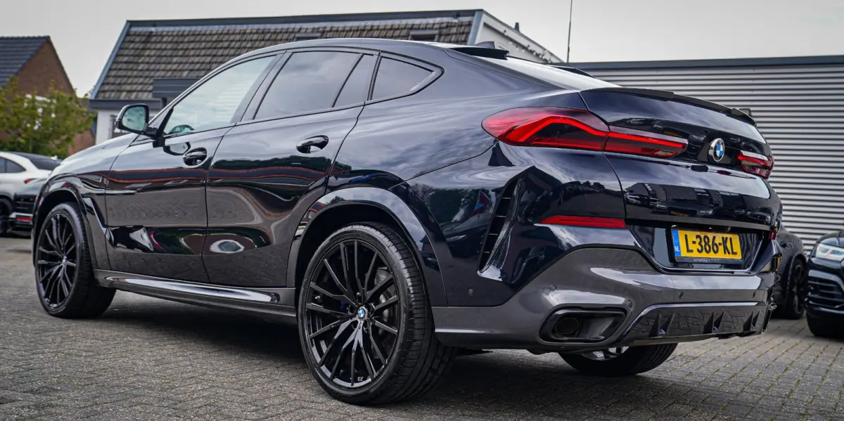 XDrive40i High Executive | Panorama | 360cam | Carbon | Adaptieve cruise control | Kristallen pook | 22 inch | Dealer onder