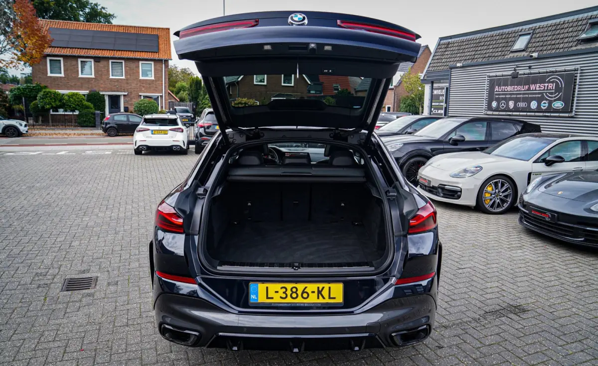 XDrive40i High Executive | Panorama | 360cam | Carbon | Adaptieve cruise control | Kristallen pook | 22 inch | Dealer onder