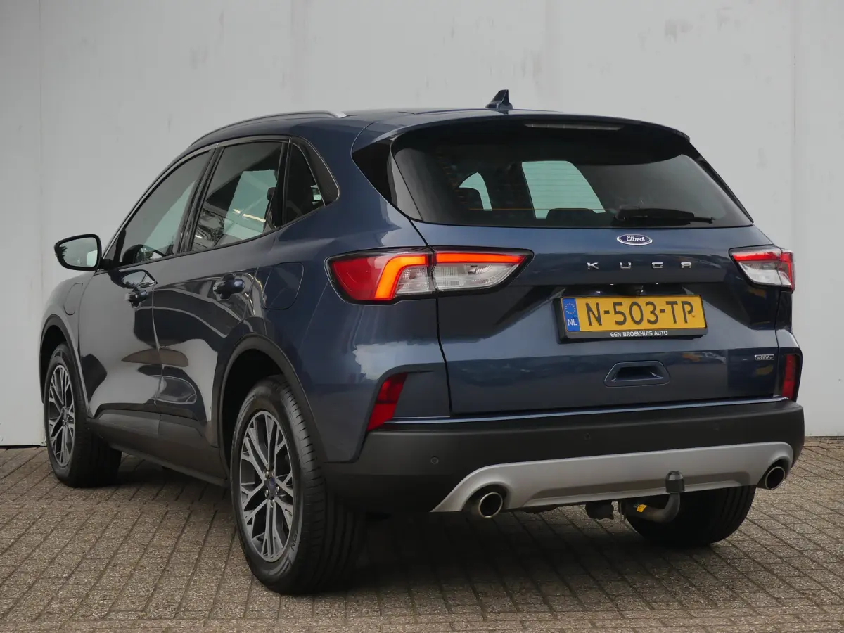 2.5 PHEV Titanium | TREKHAAK | STUUR+STOEL+VOORRUITVERWARMING | CAMERA | PARKEERSENSOREN V+A | NAVI | LMV 18" | APPLE CARPLAY / ANDROID AUTO |