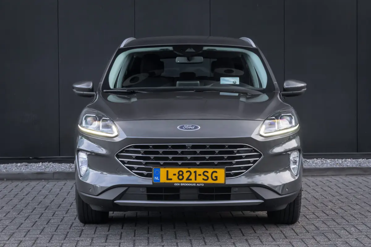 2.5 PHEV Titanium | 100% dealer o.h. | Trekhaak | Adaptieve cruise | Standkachel | Parkeercamera | Apple carplay / andriod auto