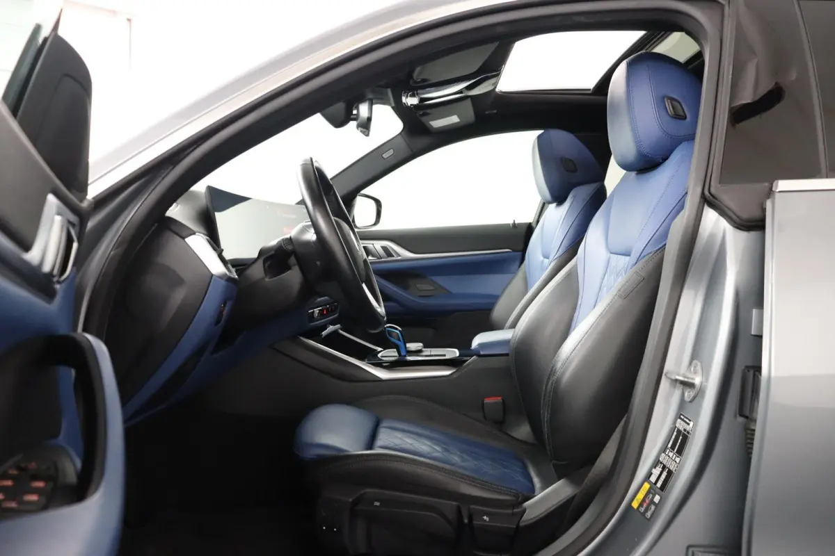 eDrive40 High Executive 84 kWh | Glazen Schuif-/kanteldak | Trekhaak Elektrisch | Volleder Individual + leder dashboard | Stoelverwarming | Driving Assistant Professional | 360 camera | Head