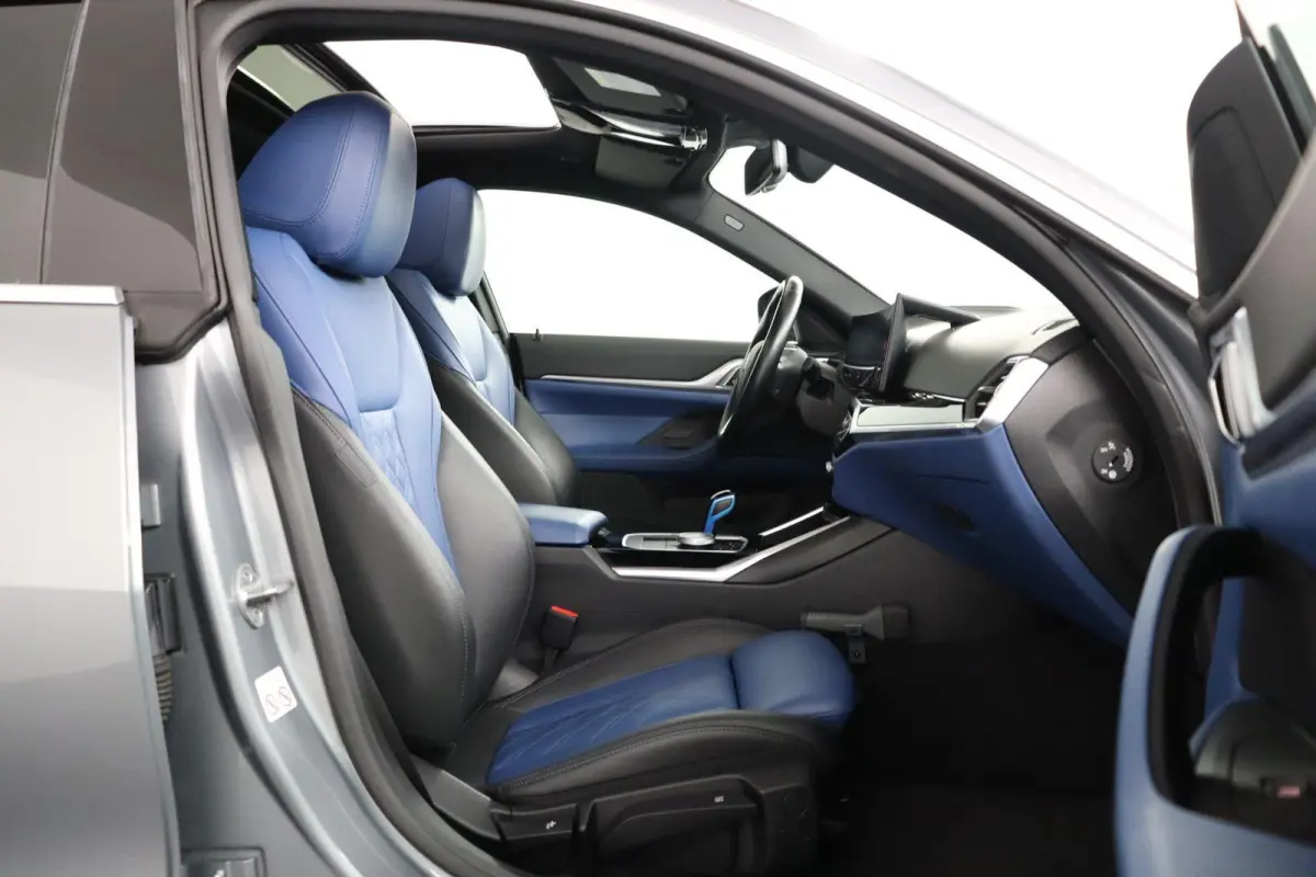 eDrive40 High Executive 84 kWh | Glazen Schuif-/kanteldak | Trekhaak Elektrisch | Volleder Individual + leder dashboard | Stoelverwarming | Driving Assistant Professional | 360 camera | Head