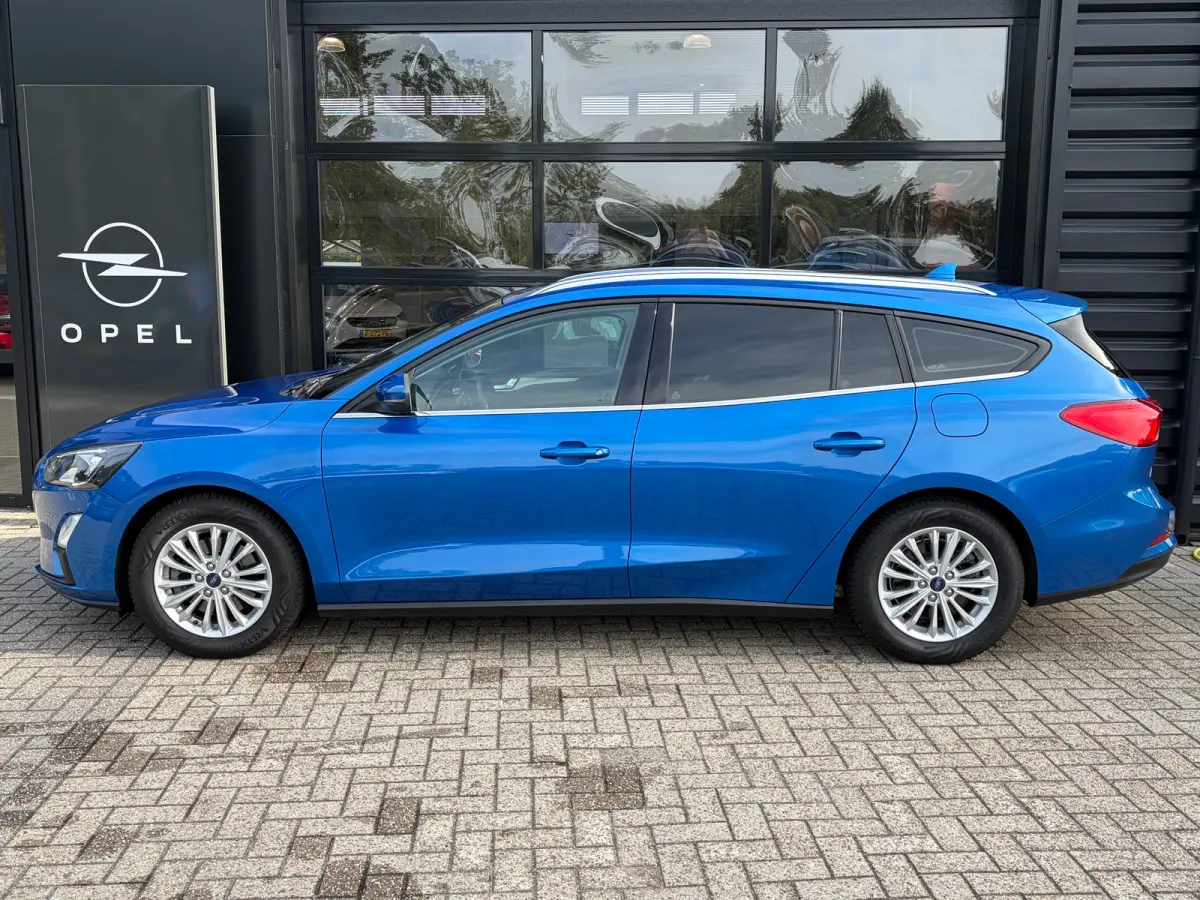 1.0 125 PK Titanium | DEALER ONDERHOUDEN| NAVIGATIE + APPLE CARPLAY/ANDROID AUTO| KEYLESS ENTRY & START| FULL LED| PARKEERSENSOREN V+A| CLIMATE CONTROL| DAB| CRUISE CONTROL|