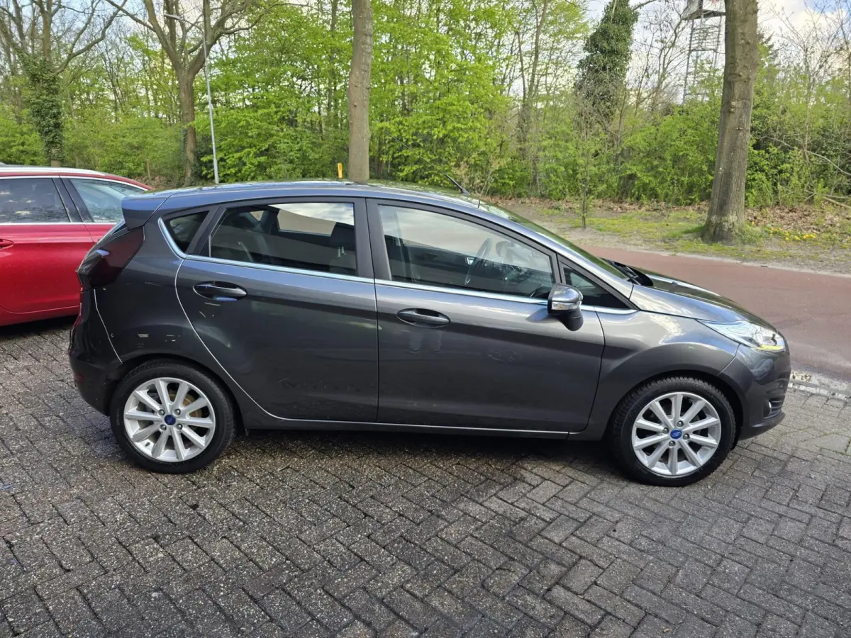 1.0 EcoBoost Titanium | 2E EIGENAAR | 12MND GARANTIE | NW DISTR | AIRCO | NAVI |