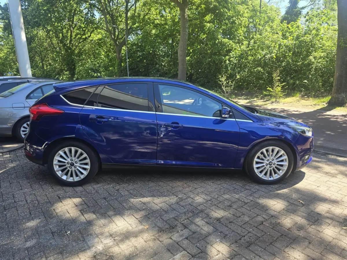 1.0 Titanium | 2E EIGENAAR |3/6 OF 12MND GARANTIE | AIRCO | CRUISE | NAVI | LMV |