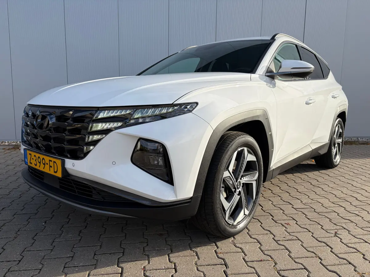 1.6 T-GDI 265pk PHEV Comfort Smart 4WD | Climate | Camera | Carplay | Keyless | Navigatie | Full - Led | Elek. Klep | Winterpakket | 19" Lichtmetaal | Krell Audio | Digitale Cockpit | Parkee