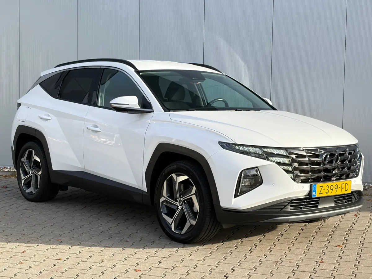 1.6 T-GDI 265pk PHEV Comfort Smart 4WD | Climate | Camera | Carplay | Keyless | Navigatie | Full - Led | Elek. Klep | Winterpakket | 19" Lichtmetaal | Krell Audio | Digitale Cockpit | Parkee
