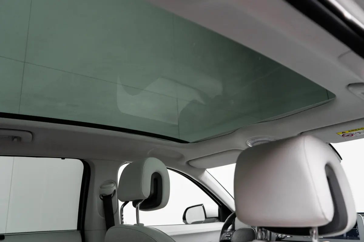 Lounge 77.4 kWh 100 SoH | 1600kg Trekgewicht | Cruise control adaptief met Stop&Go en stuurhulp | Dodehoekdetectie met correctie | Elektrisch bedienbare achterklep