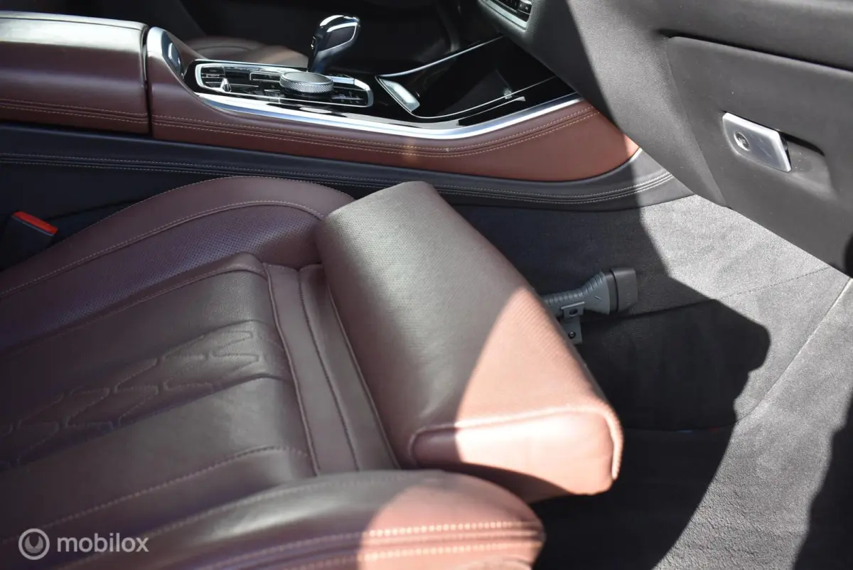 xDrive40i M-Sport Carbonschwarz Skylounge 4WS Luchtvering