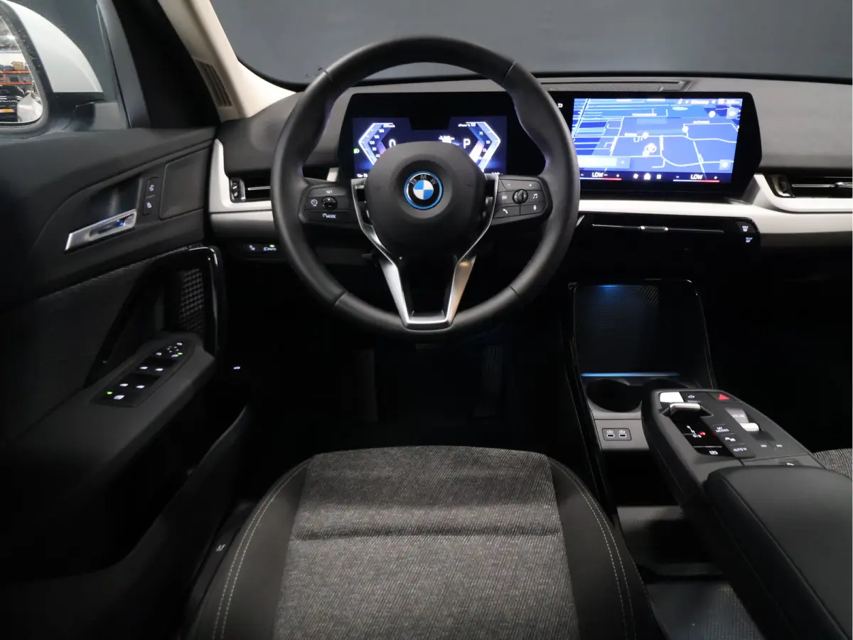 eDrive20 67 kWh [APPLE CARPLAY, ANDROID, CRUISE CONTROL, DIGITAL DASH, CAMERA, PDC V+A, SPORT, CLIMATE CONTROL, ELEKTRISCHE ACHTERKLEP,  NAVIGATIE, BLUETOOTH, NIEUWSTAAT]