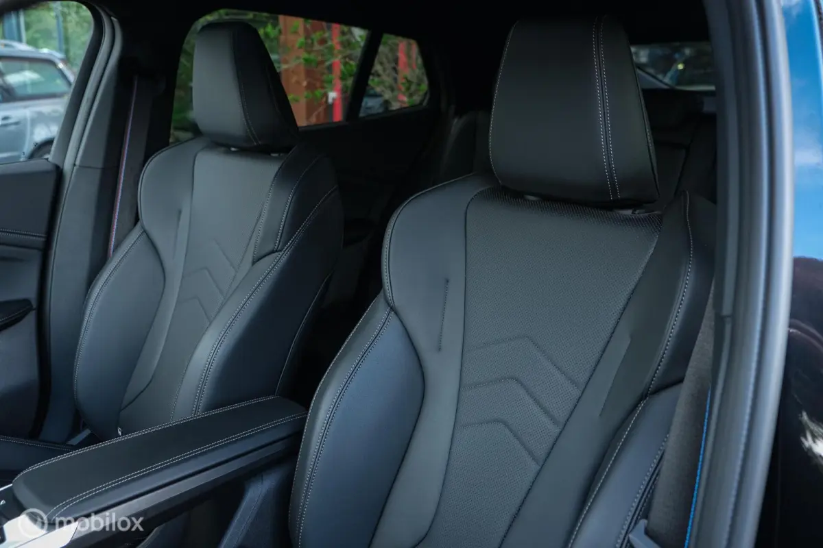 eDrive20 67 kWh | 100% SOH | M-Sportpakket | Harman Kardon | Pano | Trekhaak | ACC | Camera | M-Sportpakket Pro | Stoelverwarming | LED |