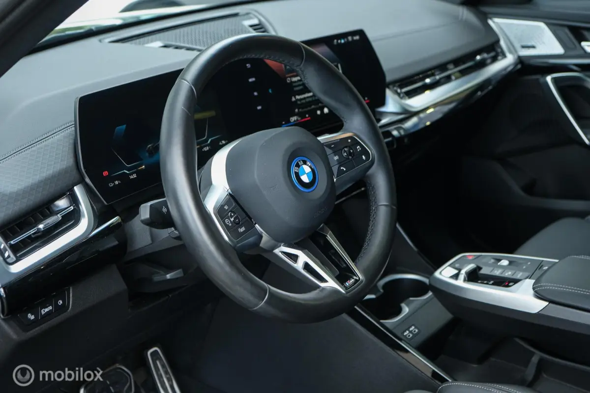 eDrive20 67 kWh | 100% SOH | M-Sportpakket | Harman Kardon | Pano | Trekhaak | ACC | Camera | M-Sportpakket Pro | Stoelverwarming | LED |