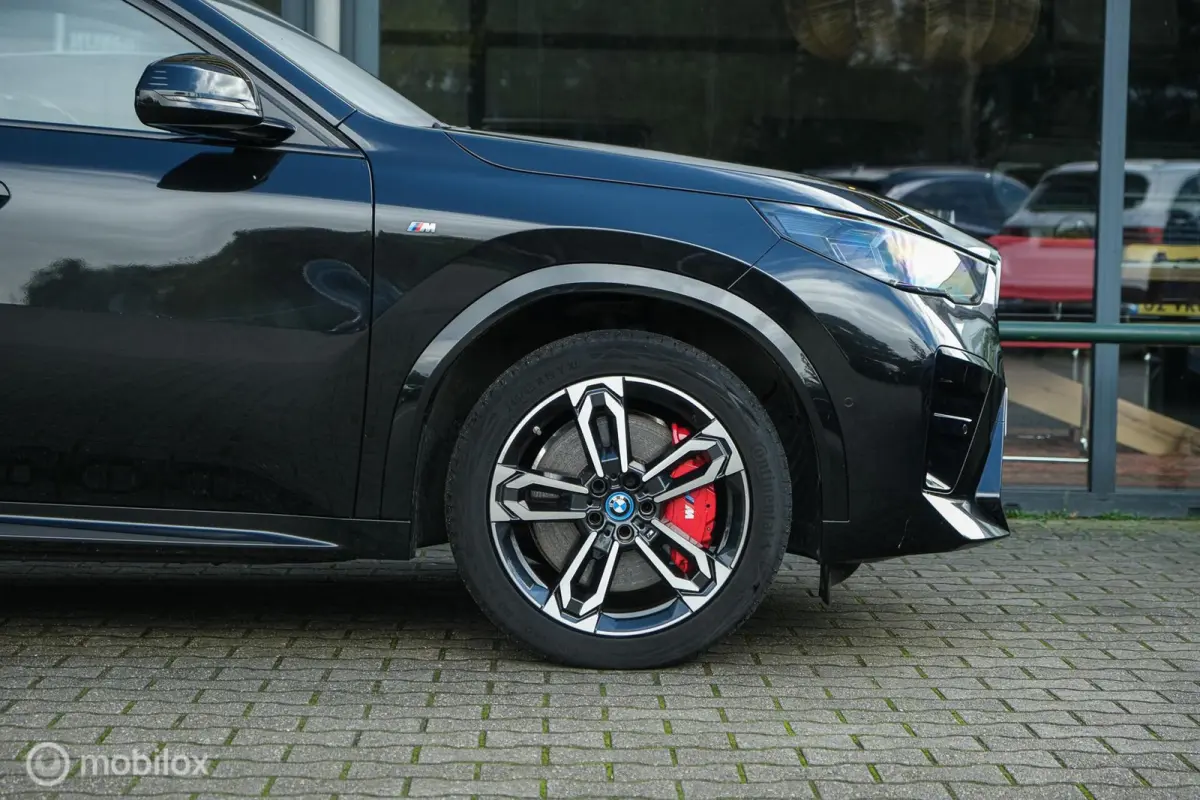 eDrive20 67 kWh | 100% SOH | M-Sportpakket | Harman Kardon | Pano | Trekhaak | ACC | Camera | M-Sportpakket Pro | Stoelverwarming | LED |