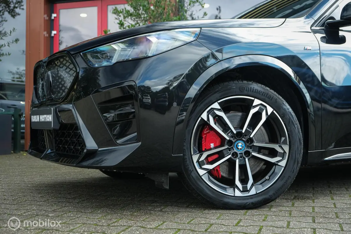 eDrive20 67 kWh | 100% SOH | M-Sportpakket | Harman Kardon | Pano | Trekhaak | ACC | Camera | M-Sportpakket Pro | Stoelverwarming | LED |