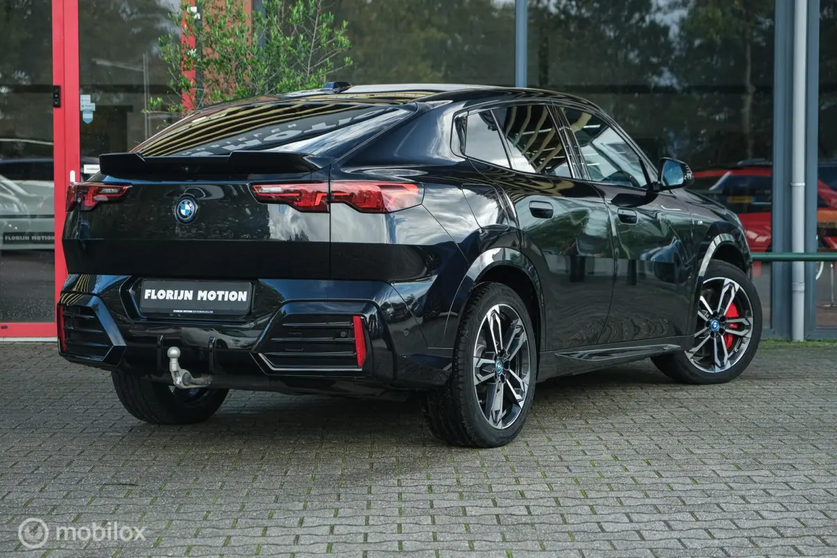 eDrive20 67 kWh | 100% SOH | M-Sportpakket | Harman Kardon | Pano | Trekhaak | ACC | Camera | M-Sportpakket Pro | Stoelverwarming | LED |