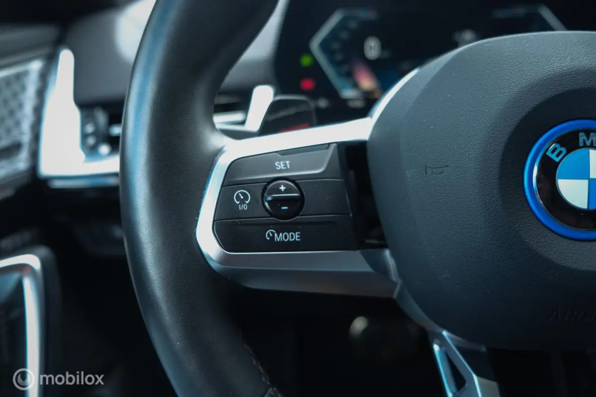 eDrive20 67 kWh | 100% SOH | M-Sportpakket | Harman Kardon | Pano | Trekhaak | ACC | Camera | M-Sportpakket Pro | Stoelverwarming | LED |