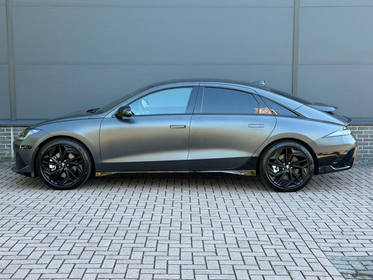 Business 77.4 kWh | Orgineel Nederlands | Navigatie | 360 Graden Camera | Stuur & Stoelverwarming | Bose Audio | Apple Carplay & Android Auto |