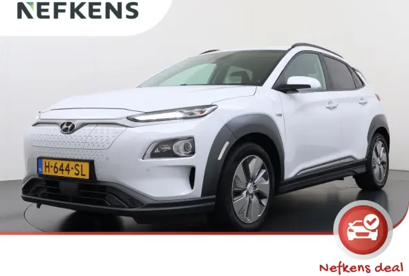 Premium 64kWh | 1ste eigenaar | ACCU 99% | Trekhaak | LEER | Camera | LED lampen | AUTOMAAT