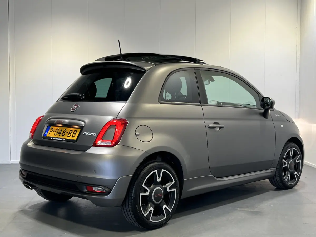 1.0 Hybrid Sport | GRIGIO ASFALTO | Navigatie/Android/Apple Carplay | LM Velgen 16" | Panoramadak | Cruise Control | Airco Automatisch |