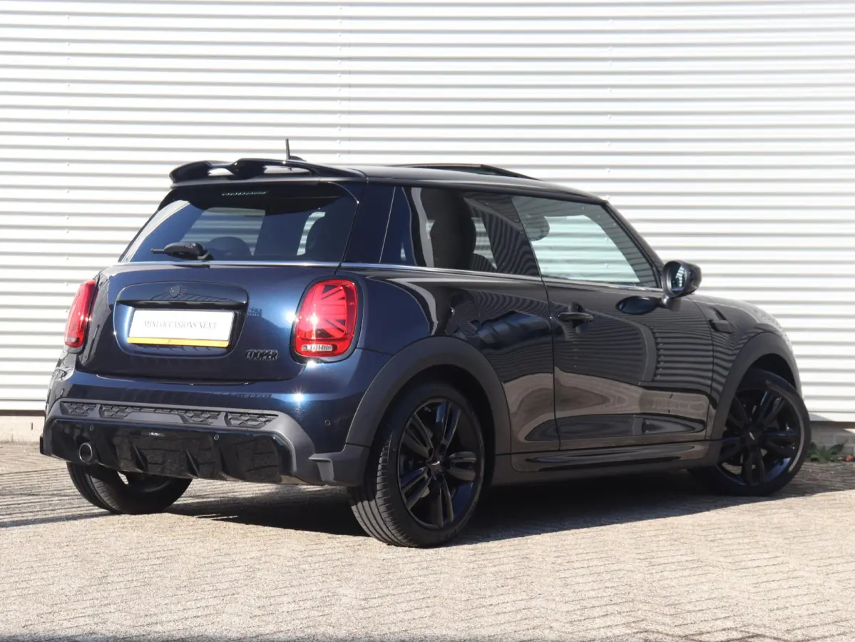 Cooper | Rockingham GT + John Cooper Works Pakket + Panodak + Sportstoelen + Apple Carplay + Adaptief Onderstel + Verwarmbare Voorstoelen + 18'' LMV