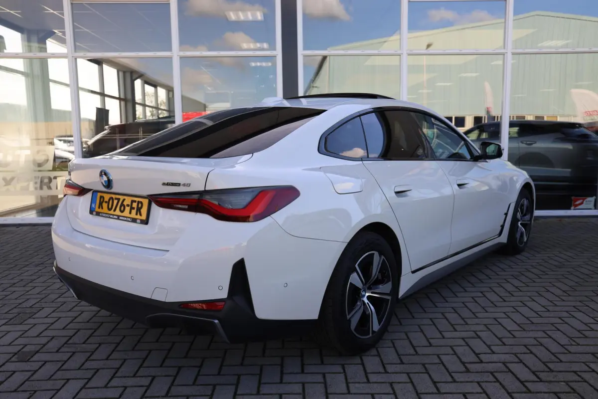 eDrive40 High Executive 84 kWh|SOH 94.5%|Schuifdak|Camera|Laser|
