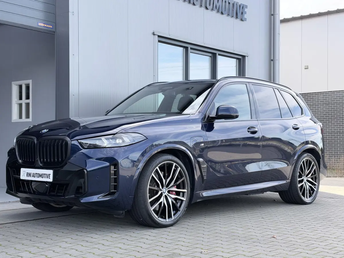 xDrive50e M sport Pro | 490 PK | Trekhaak | Pano | M Stoelen | Individual Tansanitblau metallic | Long Range
