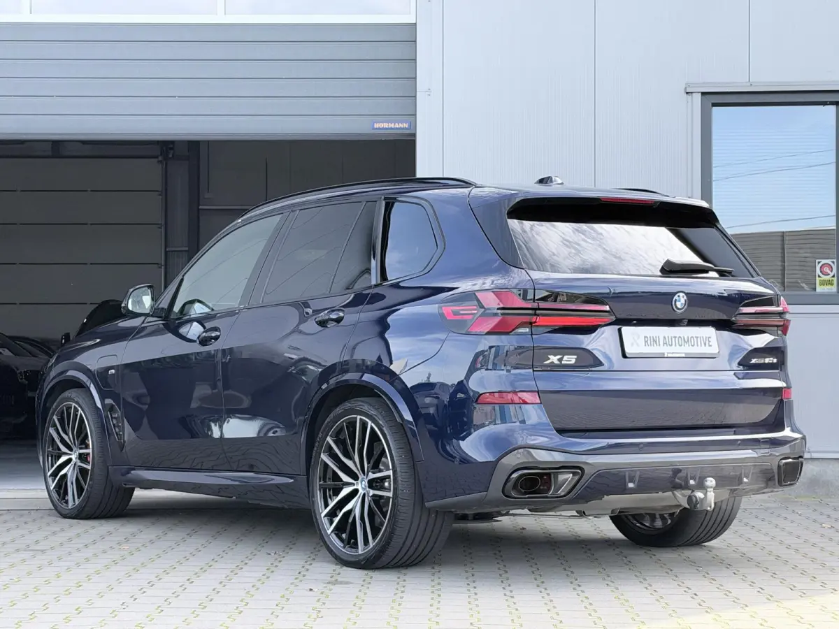 xDrive50e M sport Pro | 490 PK | Trekhaak | Pano | M Stoelen | Individual Tansanitblau metallic | Long Range
