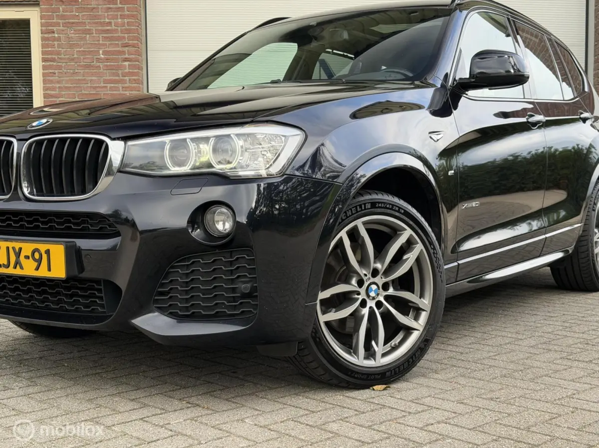 xDrive20i LCi High Executive M-Sport ORG NED Panoramdak