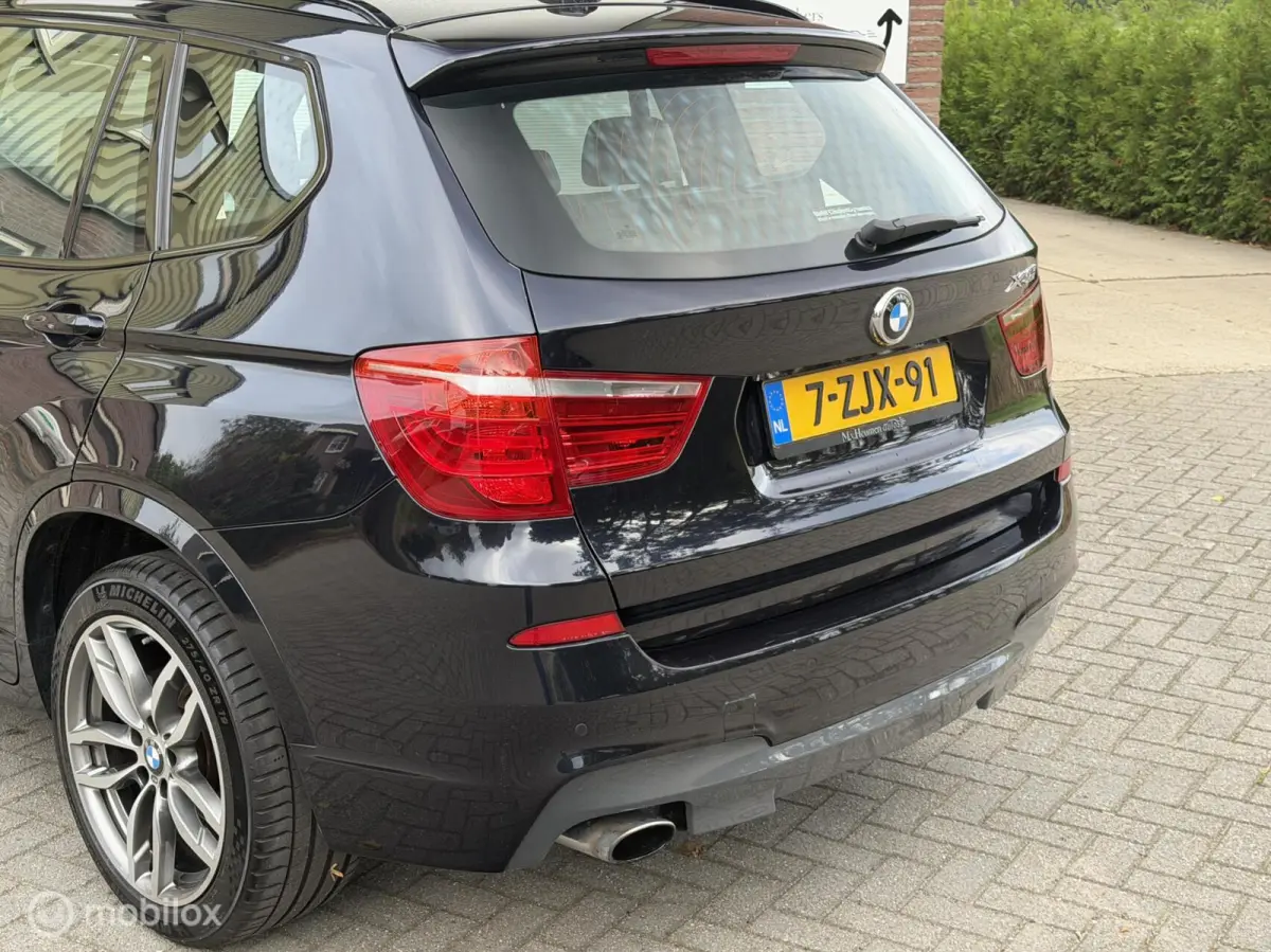xDrive20i LCi High Executive M-Sport ORG NED Panoramdak