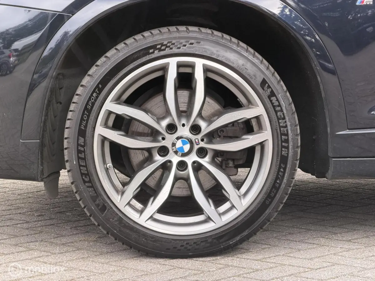 xDrive20i LCi High Executive M-Sport ORG NED Panoramdak