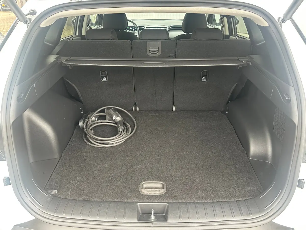 1.6 T-GDI 265pk PHEV Comfort Smart 4WD | Climate | Camera | Carplay | Keyless | Navigatie | Full - Led | Elek. Klep | Winterpakket | 19" Lichtmetaal | Krell Audio | Digitale Cockpit | Parkee