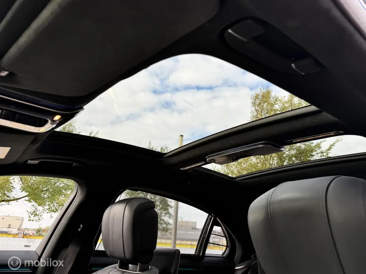 580 e 4MATIC Lang AMG Line|chauffeurspakket|pano|tv schermen|drive pilot