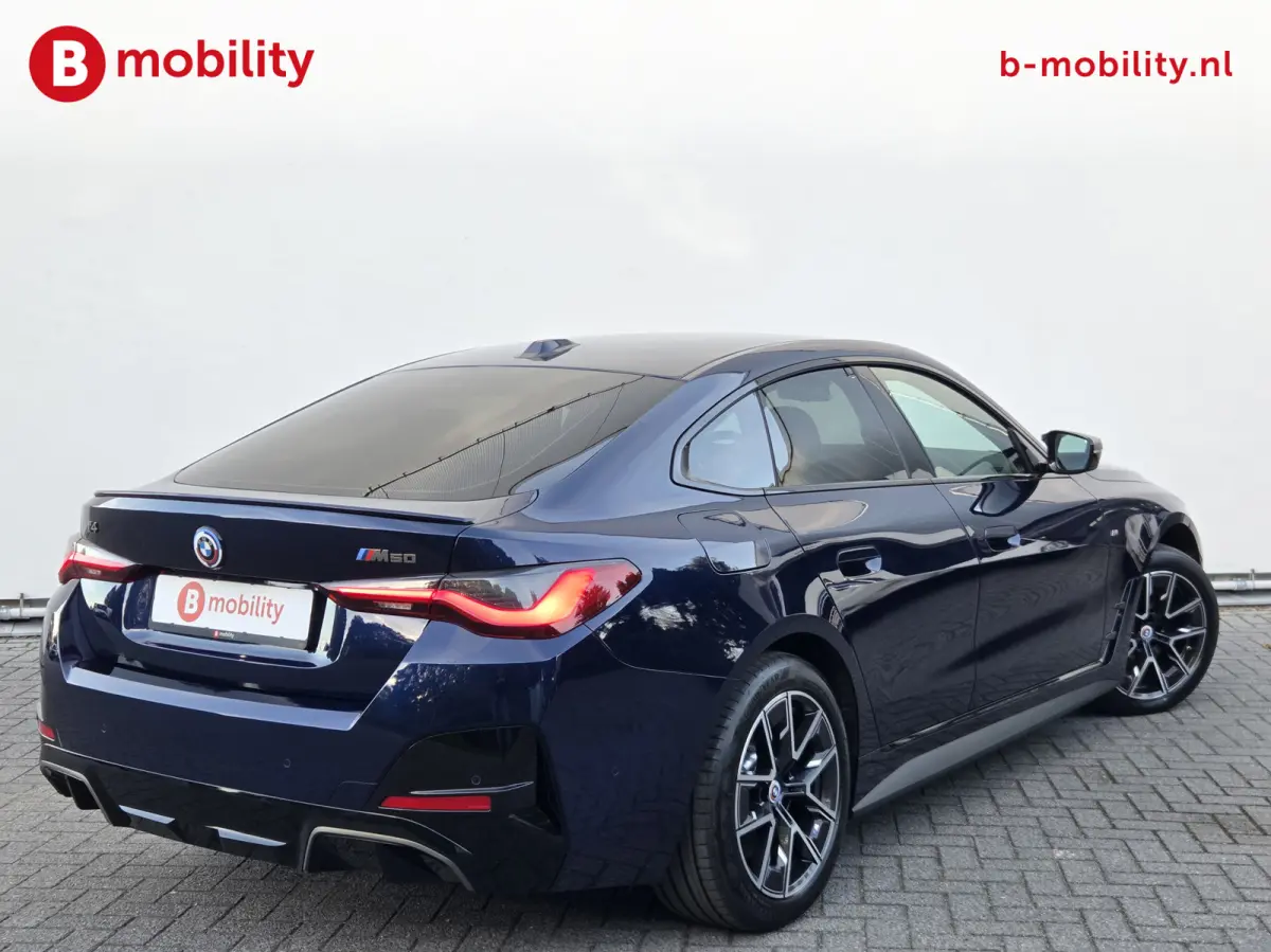 M50 High Executive M-Sport 84 kWh 'Tansanitblau' SOH 96% NL Auto! | 360 Camera | Hifi | DAB | Snelladen | Leer | Head-Up