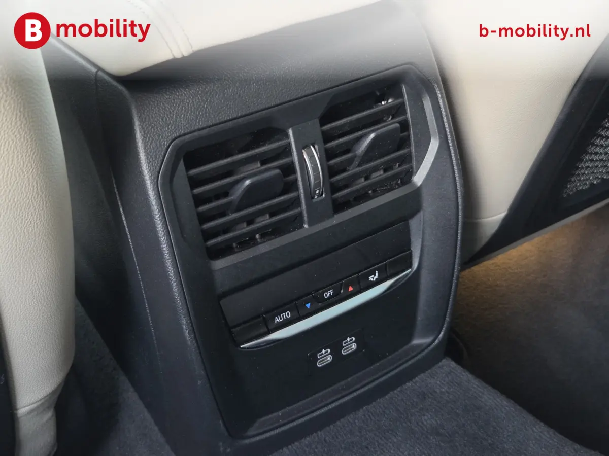 M50 High Executive M-Sport 84 kWh 'Tansanitblau' SOH 96% NL Auto! | 360 Camera | Hifi | DAB | Snelladen | Leer | Head-Up