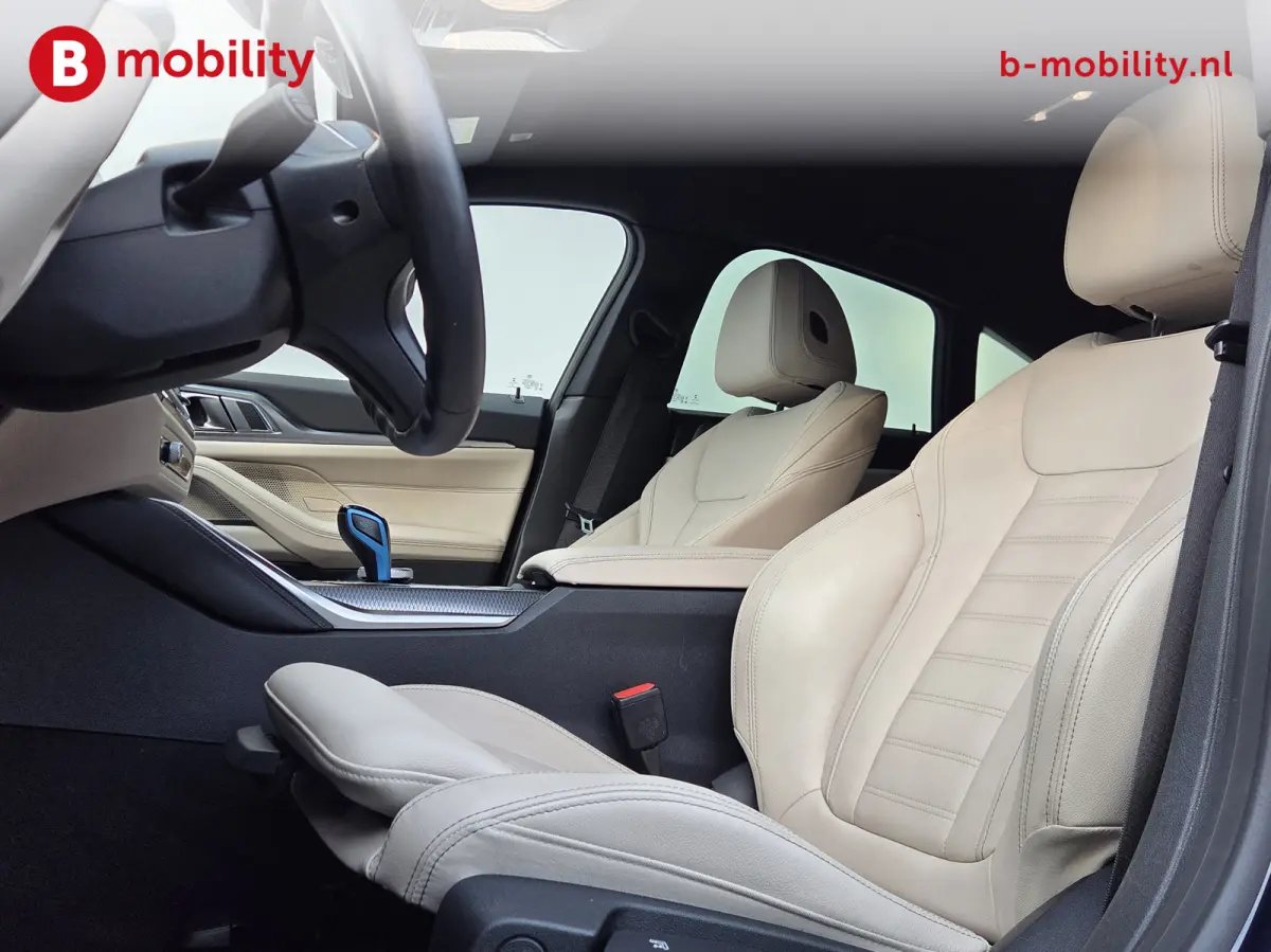 M50 High Executive M-Sport 84 kWh 'Tansanitblau' SOH 96% NL Auto! | 360 Camera | Hifi | DAB | Snelladen | Leer | Head-Up