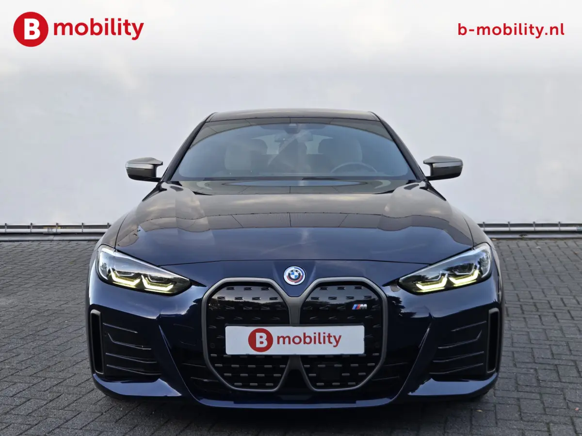 M50 High Executive M-Sport 84 kWh 'Tansanitblau' SOH 96% NL Auto! | 360 Camera | Hifi | DAB | Snelladen | Leer | Head-Up
