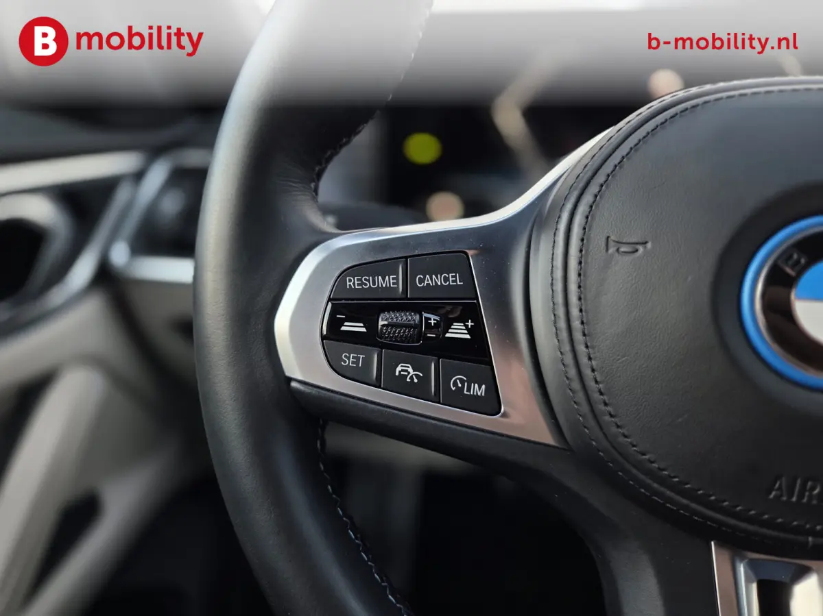 M50 High Executive M-Sport 84 kWh 'Tansanitblau' SOH 96% NL Auto! | 360 Camera | Hifi | DAB | Snelladen | Leer | Head-Up