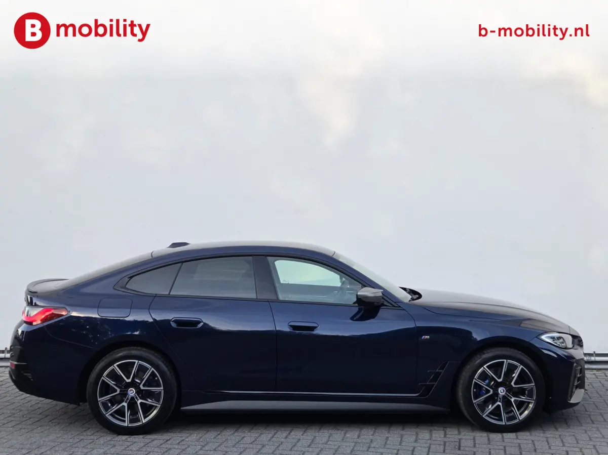 M50 High Executive M-Sport 84 kWh 'Tansanitblau' SOH 96% NL Auto! | 360 Camera | Hifi | DAB | Snelladen | Leer | Head-Up
