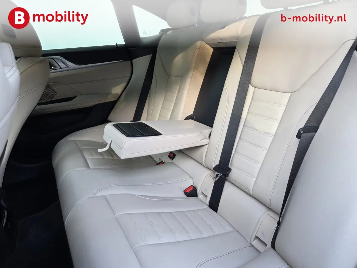 M50 High Executive M-Sport 84 kWh 'Tansanitblau' SOH 96% NL Auto! | 360 Camera | Hifi | DAB | Snelladen | Leer | Head-Up
