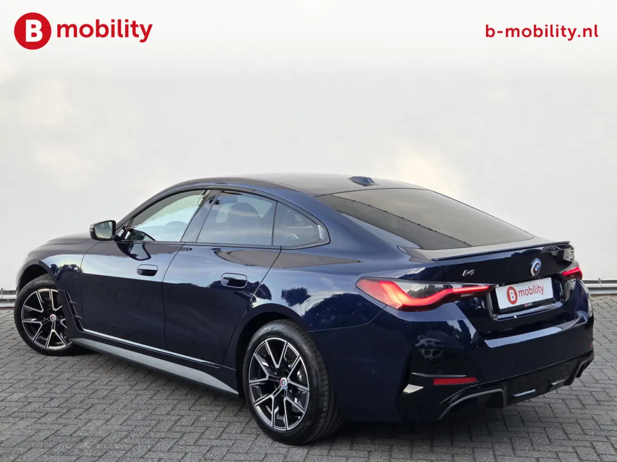 M50 High Executive M-Sport 84 kWh 'Tansanitblau' SOH 96% NL Auto! | 360 Camera | Hifi | DAB | Snelladen | Leer | Head-Up