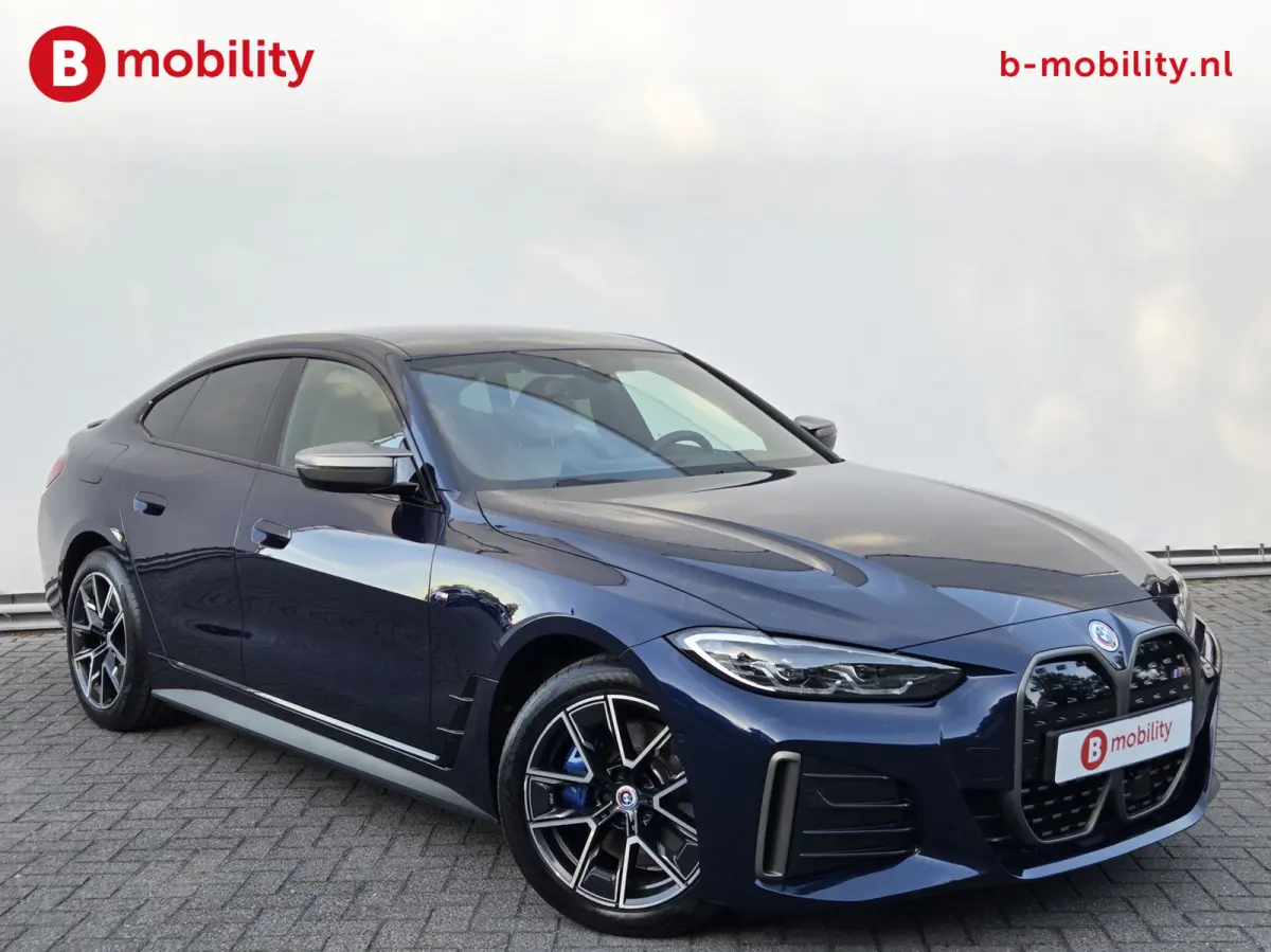 M50 High Executive M-Sport 84 kWh 'Tansanitblau' SOH 96% NL Auto! | 360 Camera | Hifi | DAB | Snelladen | Leer | Head-Up
