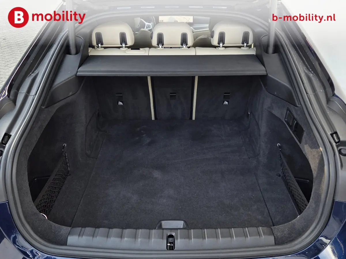 M50 High Executive M-Sport 84 kWh 'Tansanitblau' SOH 96% NL Auto! | 360 Camera | Hifi | DAB | Snelladen | Leer | Head-Up