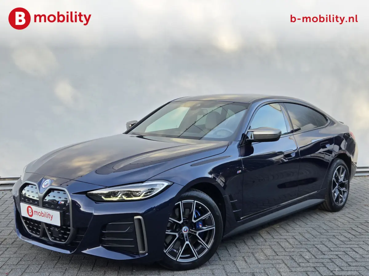 M50 High Executive M-Sport 84 kWh 'Tansanitblau' SOH 96% NL Auto! | 360 Camera | Hifi | DAB | Snelladen | Leer | Head-Up
