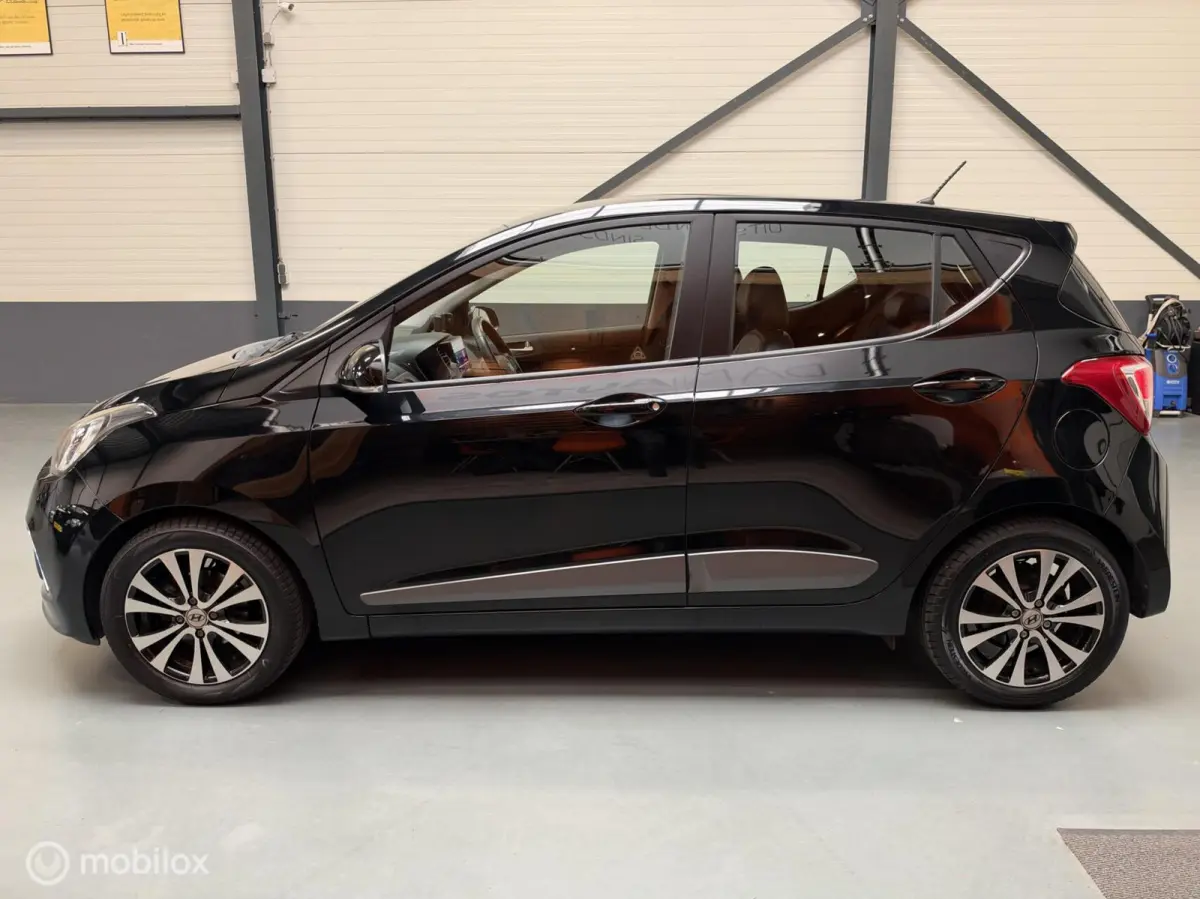 1.0i i-Motion Premium Leer|Clima|CarPlay|LED