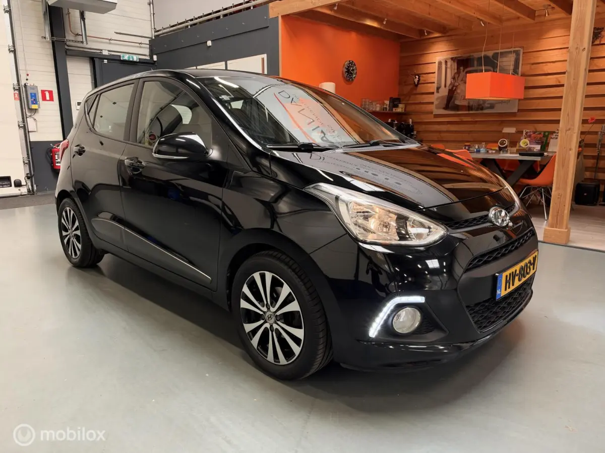 1.0i i-Motion Premium Leer|Clima|CarPlay|LED
