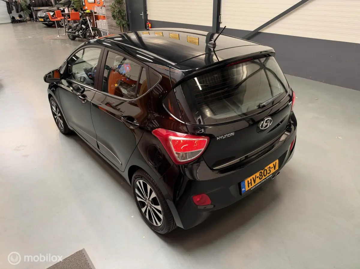 1.0i i-Motion Premium Leer|Clima|CarPlay|LED