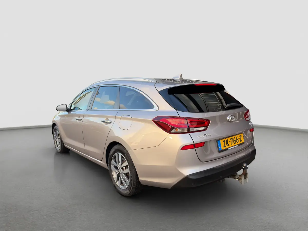 1.4 T-GDI 140pk Premium | Camera | Trekhaak | Climate controle | Carplay | Cruise controle | Half leder | Navigatie | Parkeersensoren